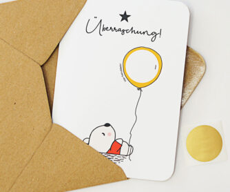 Rubbelkarte mit einem Bär, der einen Luftballon (mit beschreibbarem Rubbelfeld) hält und der Überschrift 