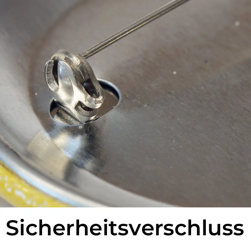 Ein drehbarer Riegel verhindert das unbeabsichtigte Öffnen des Sicherheitsverschlusses am 56 mm Button.